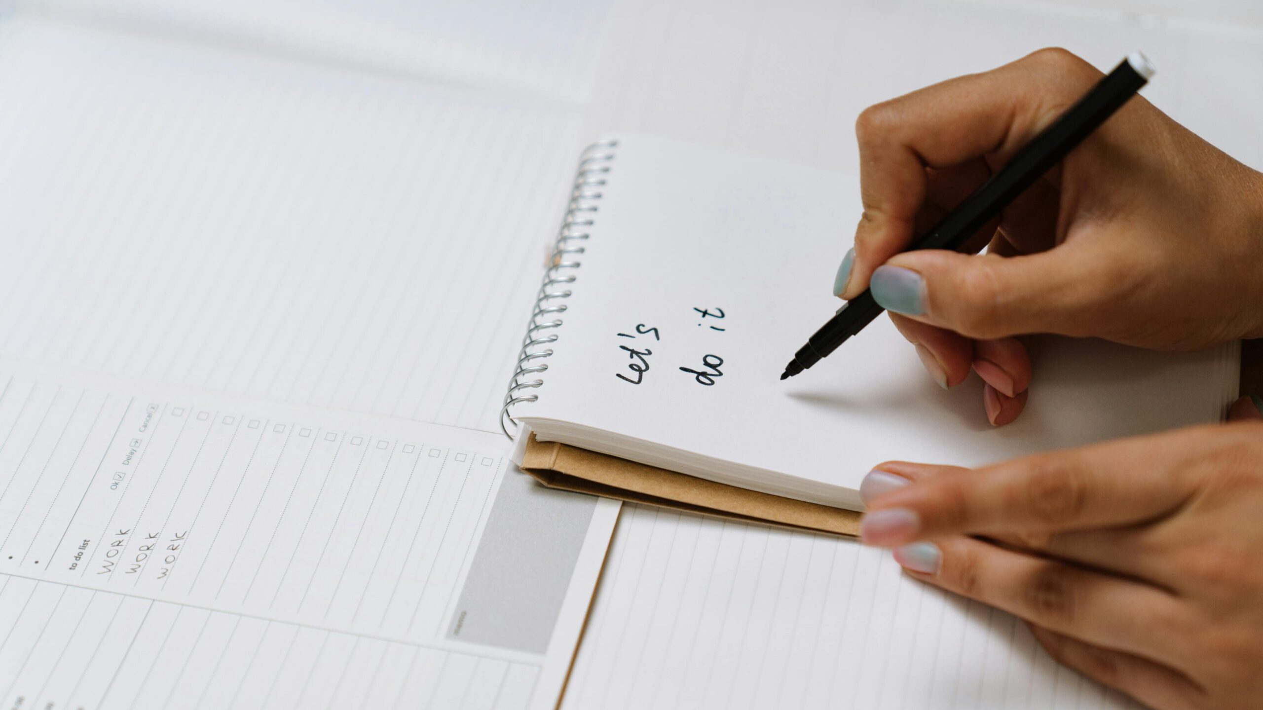 A Person Writing on White Paper
